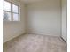 Well-lit bedroom featuring carpet flooring at 1455 S Vaughn Cir, Aurora, CO 80012