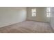 Spacious bedroom with neutral decor and carpet at 1455 S Vaughn Cir, Aurora, CO 80012