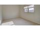 Bright bedroom with neutral walls and carpet at 1455 S Vaughn Cir, Aurora, CO 80012