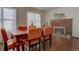 Dining area with hardwood floors and a brick fireplace at 1455 S Vaughn Cir, Aurora, CO 80012