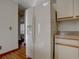 White refrigerator with icemaker in kitchen at 1455 S Vaughn Cir, Aurora, CO 80012