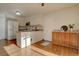 Galley kitchen with island and hardwood floors at 1455 S Vaughn Cir, Aurora, CO 80012