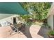 Charming backyard patio with outdoor dining set, sun shade, and landscaped garden at 331 Sherman St, Longmont, CO 80501