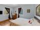 Cozy bedroom has hardwood floors, neutral wall color, and dresser at 331 Sherman St, Longmont, CO 80501