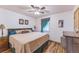 Relaxing bedroom featuring wood floors, a large window with curtain, and antique side table at 331 Sherman St, Longmont, CO 80501