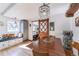 Charming dining area featuring a wooden table and a built-in bench seat near a sliding barn door at 331 Sherman St, Longmont, CO 80501