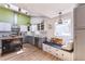 Bright kitchen featuring two-tone cabinets, a skylight, and a cozy eat-in bench at 331 Sherman St, Longmont, CO 80501