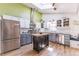 Modern kitchen with stainless steel appliances, an island with butcher block top, and ample cabinet space at 331 Sherman St, Longmont, CO 80501