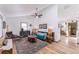 Spacious living area with hardwood floors, high ceilings, and stylish furnishings for a comfortable feel at 331 Sherman St, Longmont, CO 80501