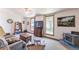 Relaxing living room boasts a wood-burning stove, large windows, a comfy sofa, and natural decor at 331 Sherman St, Longmont, CO 80501