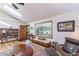 Cozy living room featuring a skylight, hardwood floors, and comfortable seating arrangements at 331 Sherman St, Longmont, CO 80501