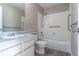 Standard bathroom with a tub, shower, and grab bars for accessibility at 7790 W 87Th Drive Dr # D, Arvada, CO 80005