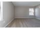 Bright bedroom with soft carpeting, a window offering natural light, and a neutral color palette at 7790 W 87Th Drive Dr # D, Arvada, CO 80005