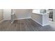 Bright living area with modern flooring, a convenient kitchen pass-through, and a welcoming front door at 7790 W 87Th Drive Dr # D, Arvada, CO 80005