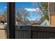 View of the front yard and neighborhood buildings from a private balcony at 7790 W 87Th Drive Dr # D, Arvada, CO 80005