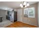 Kitchen with hardwood floors, stainless steel refrigerator, and dining area at 9320 W 48Th Ave, Wheat Ridge, CO 80033