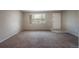 Neutral living room featuring carpet and a window at 9320 W 48Th Ave, Wheat Ridge, CO 80033