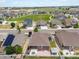 A residential area showing a mix of homes with a nearby community park and open green space at 5205 Periwinkle Way, Brighton, CO 80640