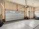 Spacious two-car garage with paneled doors and automatic openers offers plenty of storage and parking at 5205 Periwinkle Way, Brighton, CO 80640