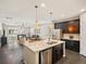Spacious living room connects seamlessly to the kitchen creating a bright and inviting atmosphere at 5205 Periwinkle Way, Brighton, CO 80640