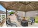 Inviting backyard patio with a gazebo, fire pit, and comfortable seating for outdoor relaxation and entertaining at 5205 Periwinkle Way, Brighton, CO 80640