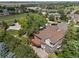 Aerial view of a home in a neighborhood with lush landscaping and mature trees at 9117 Buck Hill Dr, Highlands Ranch, CO 80126