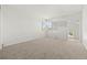 Empty bedroom featuring neutral carpet and a single window allowing natural light to enter, creating a versatile living space at 9117 Buck Hill Dr, Highlands Ranch, CO 80126