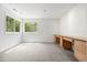 Bright bedroom with carpeted floors, natural lighting, and built-in desk at 9117 Buck Hill Dr, Highlands Ranch, CO 80126