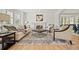 Bright living room with fireplace, neutral decor, and hardwood flooring at 9117 Buck Hill Dr, Highlands Ranch, CO 80126