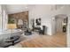 Inviting living room featuring a brick fireplace and comfortable seating at 9117 Buck Hill Dr, Highlands Ranch, CO 80126