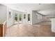 Bright sunroom features tile flooring, neutral walls, and multiple access points to backyard at 9117 Buck Hill Dr, Highlands Ranch, CO 80126