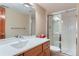 Bright bathroom featuring a glass-enclosed shower, a vanity with a modern sink, and neutral decor at 5420 Crestone Cir, Boulder, CO 80301