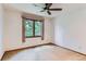 Bedroom with a window with natural light and a ceiling fan at 5420 Crestone Cir, Boulder, CO 80301
