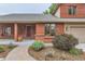 Charming home featuring an inviting covered front porch and meticulously landscaped front yard at 5420 Crestone Cir, Boulder, CO 80301
