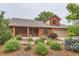 Inviting home featuring an inviting covered front porch and meticulously landscaped front yard at 5420 Crestone Cir, Boulder, CO 80301