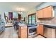 Open-concept kitchen with stainless appliances and view of dining area and living room at 5420 Crestone Cir, Boulder, CO 80301