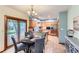 Eat-in kitchen with stainless steel appliances, tile floors, and access to the backyard patio at 5420 Crestone Cir, Boulder, CO 80301