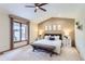 Spacious primary bedroom with carpet, a window, and a vaulted ceiling at 5420 Crestone Cir, Boulder, CO 80301