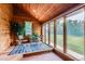 Cozy sunroom filled with natural light and wood paneling, ideal for relaxation and enjoying the outdoors at 5420 Crestone Cir, Boulder, CO 80301