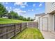 A quaint backyard with a wood fence and lush green grass perfect for relaxation at 3078 W 107Th Pl # D, Westminster, CO 80031