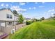 Fenced backyard space with well-maintained lawn and lush green surroundings at 3078 W 107Th Pl # D, Westminster, CO 80031