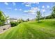 Expansive backyard space featuring lush greenery and distant homes in view at 3078 W 107Th Pl # D, Westminster, CO 80031