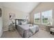 Inviting bedroom with plush carpet, vaulted ceiling, and soft natural light at 3078 W 107Th Pl # D, Westminster, CO 80031