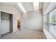 Spacious bedroom featuring a large window, skylights, and a closet for storage at 3078 W 107Th Pl # D, Westminster, CO 80031