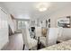 Bright dining area adjacent to living room with modern chandelier at 3078 W 107Th Pl # D, Westminster, CO 80031