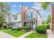 Charming townhome featuring a landscaped front yard and classic architectural details at 3078 W 107Th Pl # D, Westminster, CO 80031