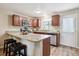 Kitchen featuring granite countertops, stainless steel appliances, and breakfast bar seating at 3078 W 107Th Pl # D, Westminster, CO 80031