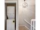 Convenient in-unit laundry with a modern stacked washer and dryer setup by the stairs at 3078 W 107Th Pl # D, Westminster, CO 80031