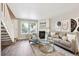 Bright living room featuring a cozy fireplace and modern decor at 3078 W 107Th Pl # D, Westminster, CO 80031