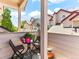 Quaint balcony offering outdoor seating and views of nearby homes and blue skies at 8361 S Upham Way # 209, Littleton, CO 80128